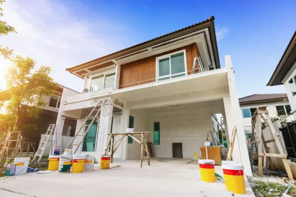 Exterior view of new house under construction and painting.House